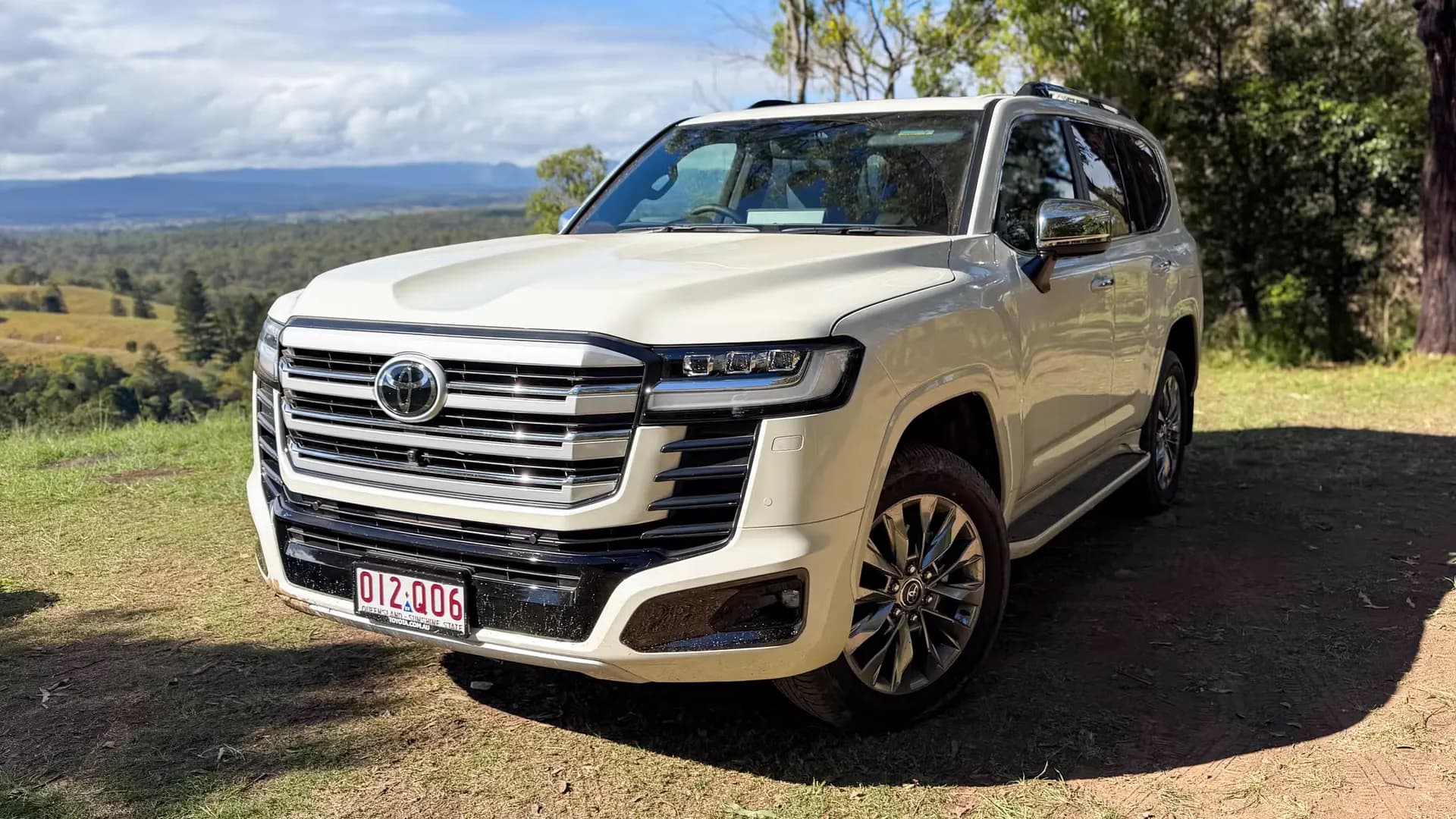 White Toyota Land Cruiser parked on a hillside
